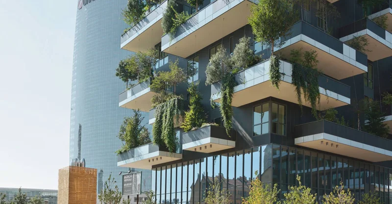 Edifício moderno com painéis solares e telhado verde, simbolizando eficiência energética