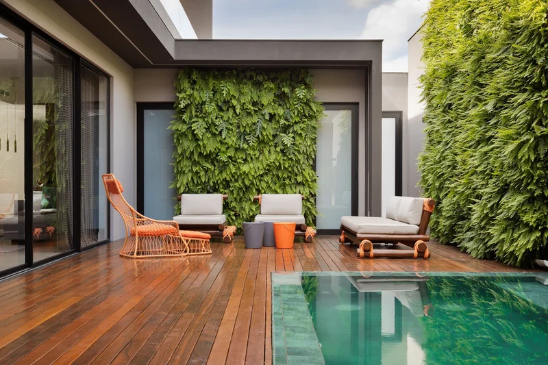 Projeto elegante de área externa com móveis modulares